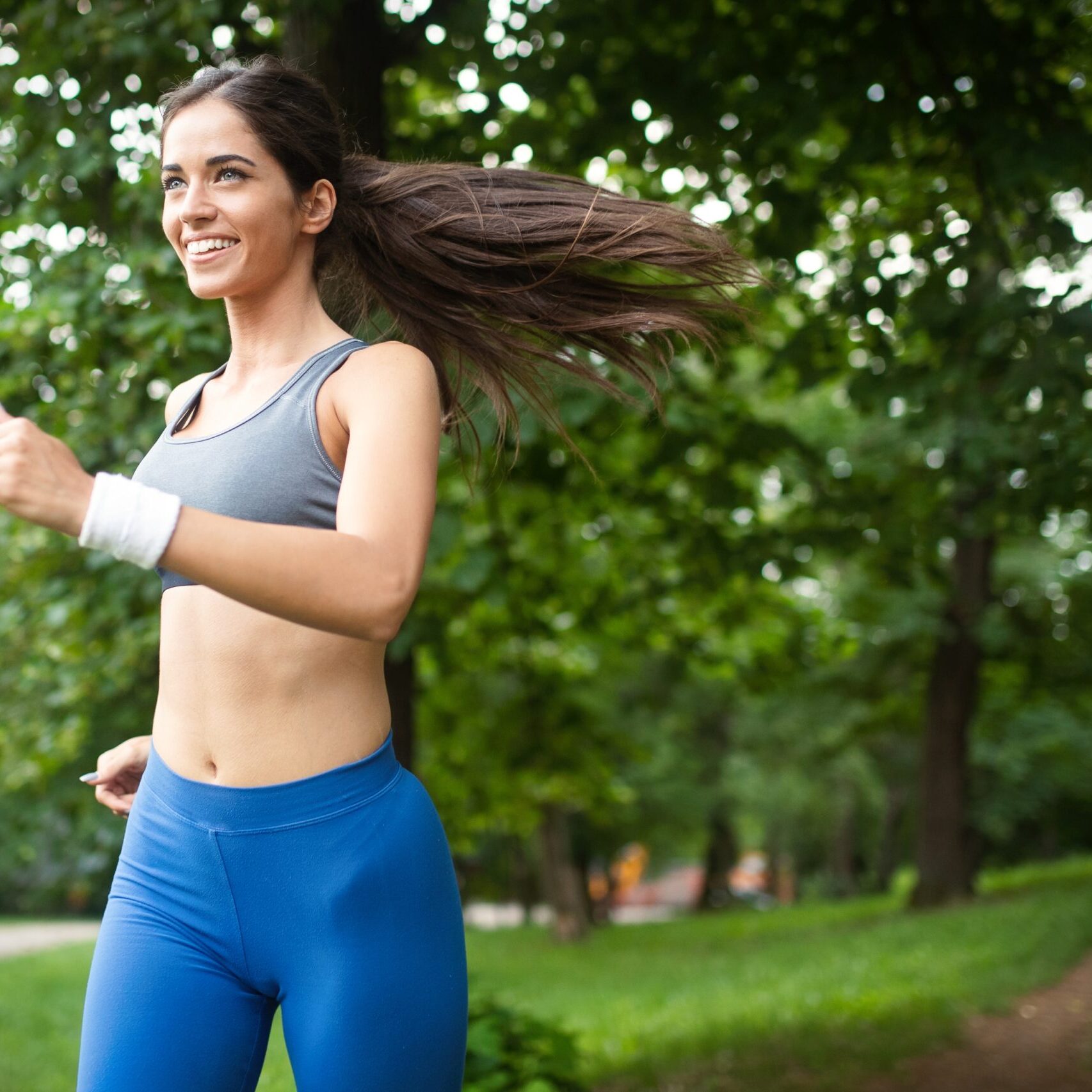Healthy lifestyle image of young woman exercising outdoor